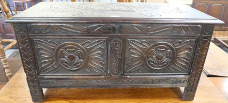 A 17th Century style carved oak blanket box