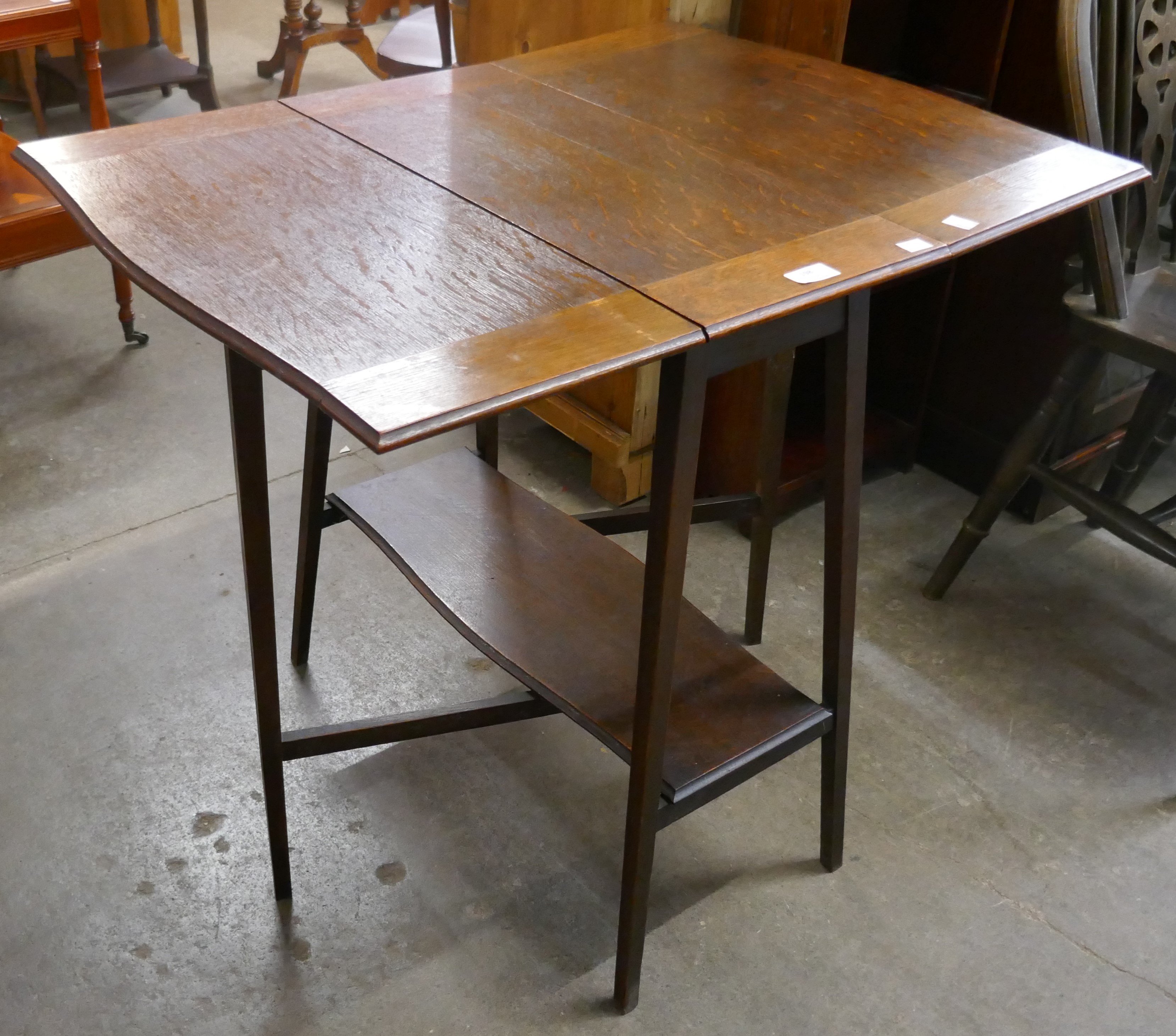 A Liberty's style Arts and Crafts drop-leaf oak table - Image 3 of 4