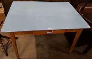 A teak and Formica topped kitchen table
