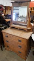 An Arts and Crafts oak dressing chest