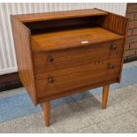 A small teak chest of drawers