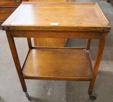 An oak two tier fold over trolley