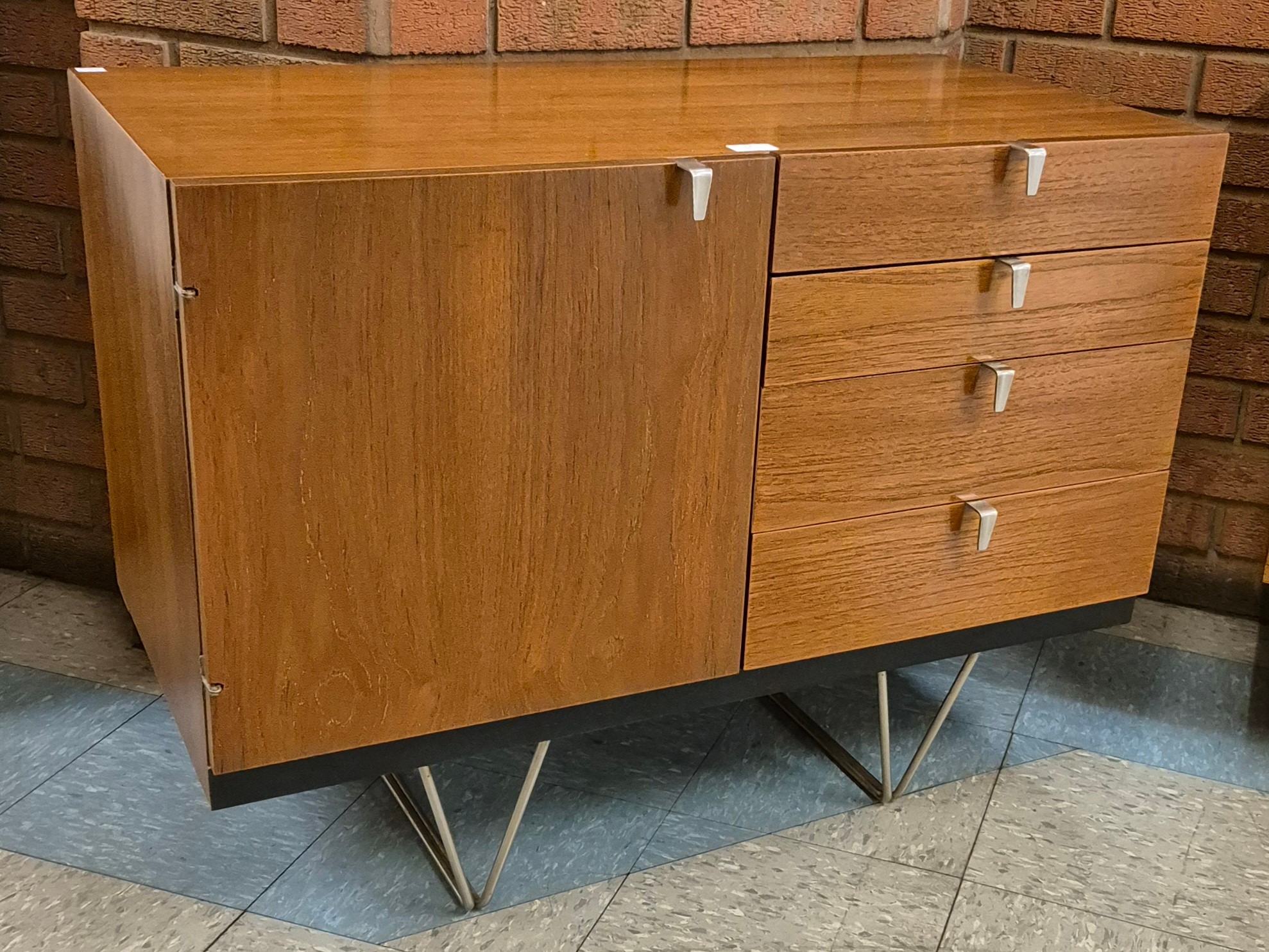 A Stag S-Range teak sideboard, on chrome hairpin legs, designed by John & Sylvia Reid