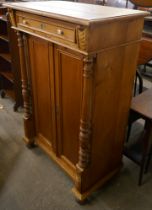A Victorian French pine cupboard