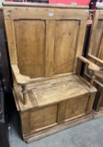 A Victorian style pine settle