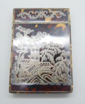 A tortoiseshell card case with silver overlay and silver cartouche to lid, 65mm x 95mm