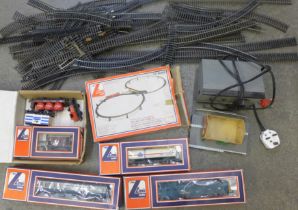 A collection of model rail accessories; transformer, platform, station, train tracks, Lima Amoco