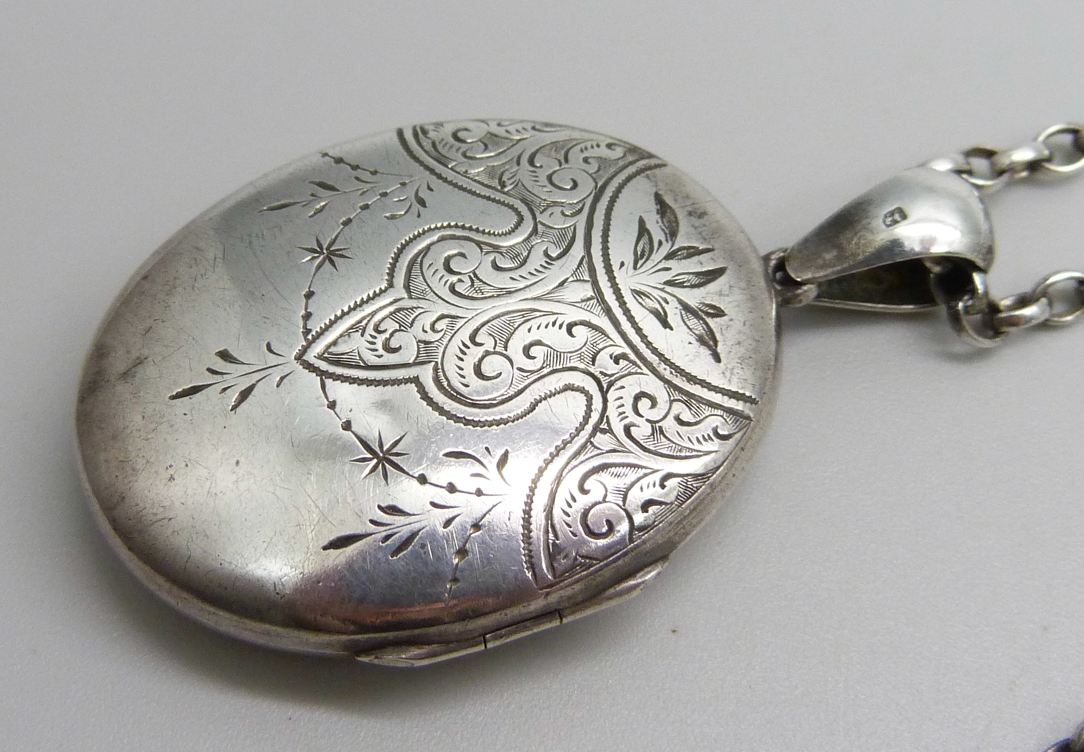 A Victorian silver locket, Birmingham 1881, on a modern silver belcher chain, 23g total, locket 5. - Image 2 of 3