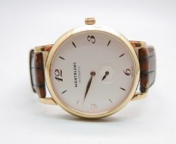 An 18ct gold Mont Blanc automatic wristwatch, model 107076, 7214-PL886928, with box and service