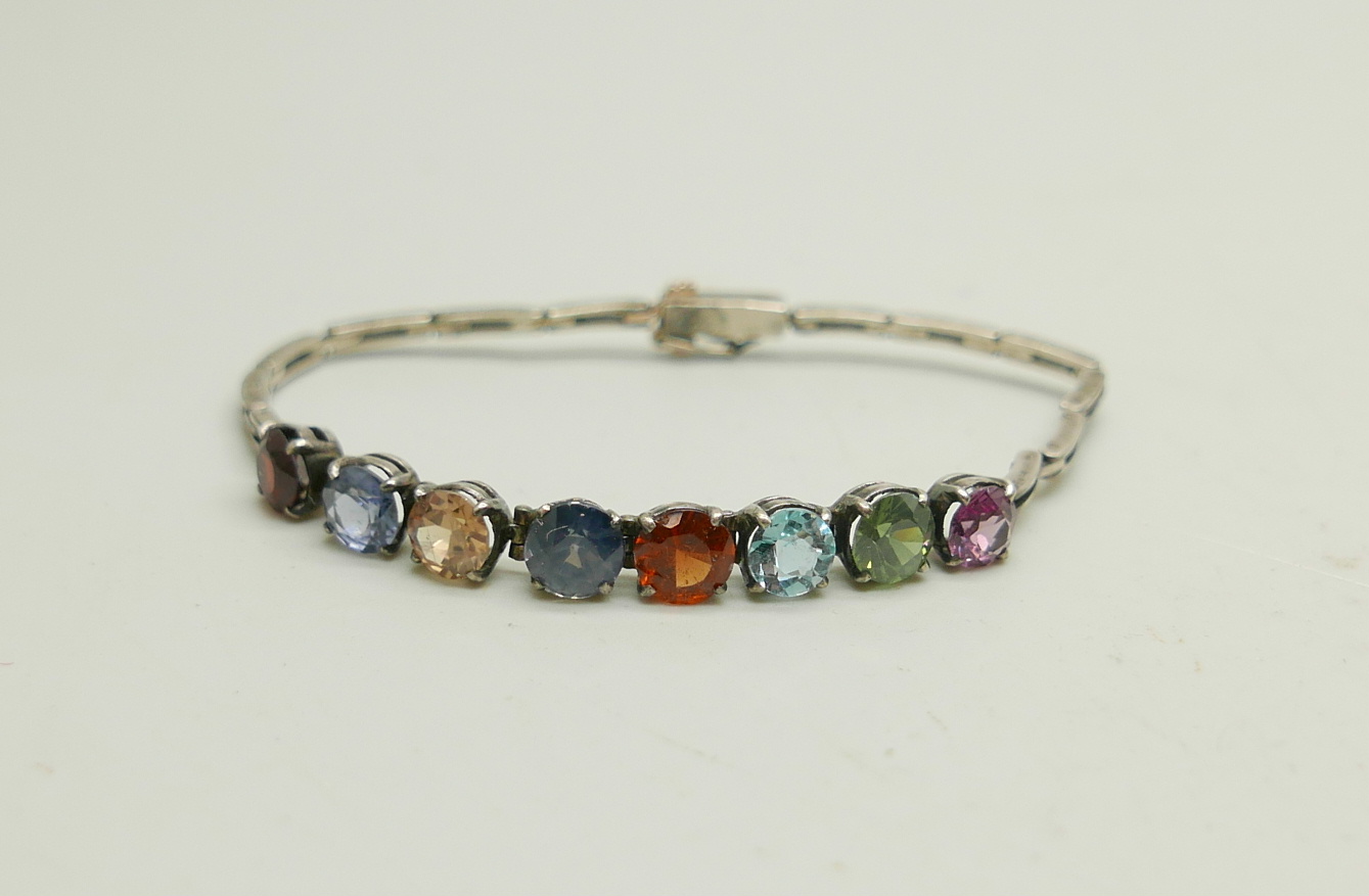 A white metal bracelet set with eight multi-coloured stones, 8g, approximately 16.5cm long - Image 2 of 3