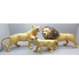 A set of three Beswick lions