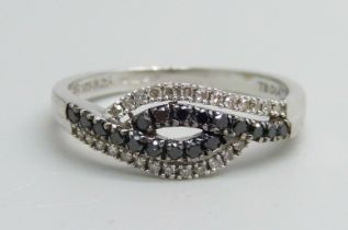 A 9ct white gold, black and white diamond ring, 2.2g, P