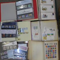 A collection of stamps; British presentation packs, assorted covers, two Stamp of the World album