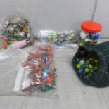 A collection of marbles and plastic toy soldiers, cowboys, Indians, etc. **PLEASE NOTE THIS LOT IS