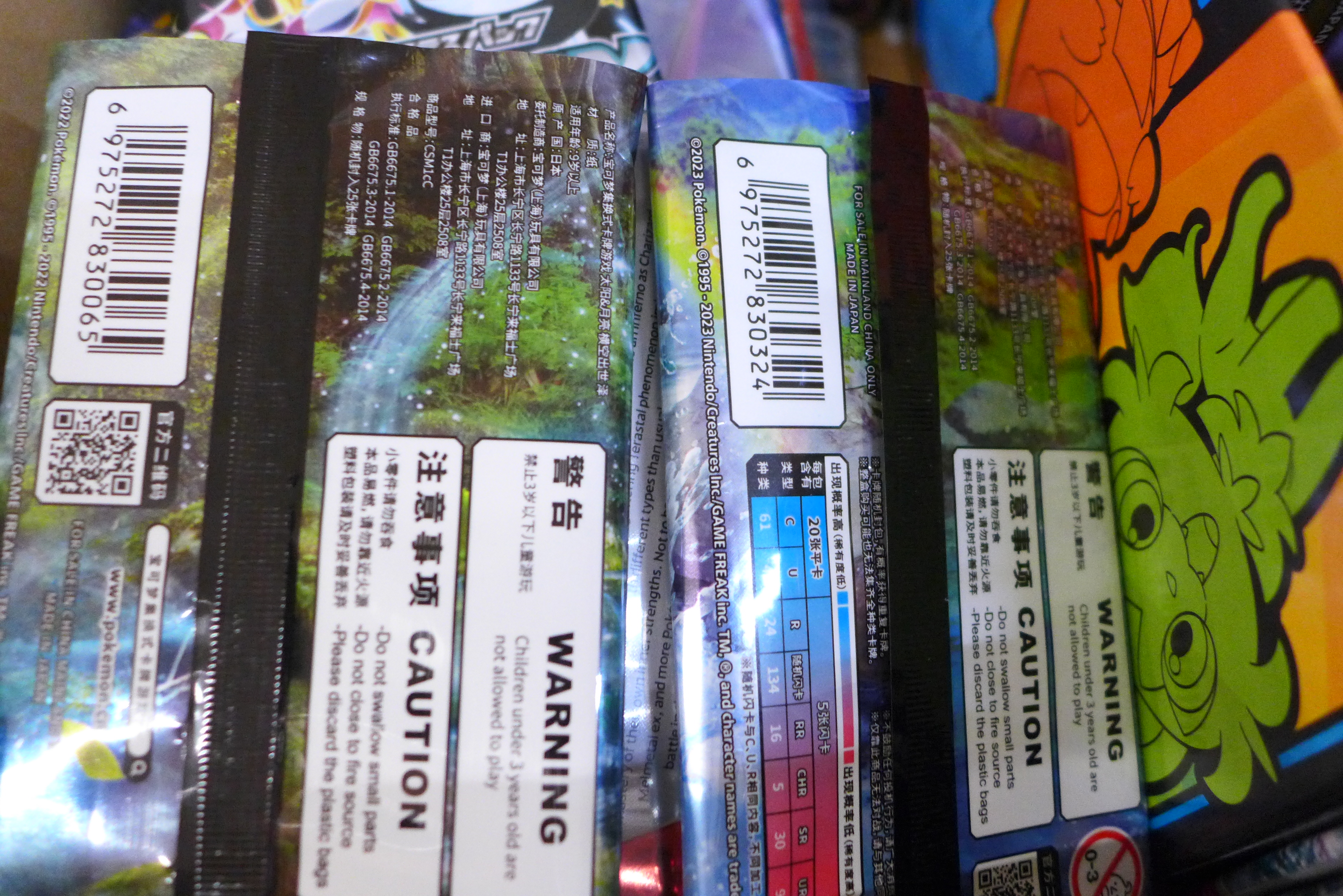 A box of English and Japanese Pokemon Evolutions packs, opened plus Chinese and Korean - Image 3 of 7