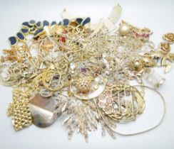 A collection of gold tone jewellery including a rolled gold watch strap