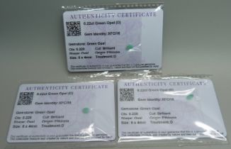 Three green opals, with certificates