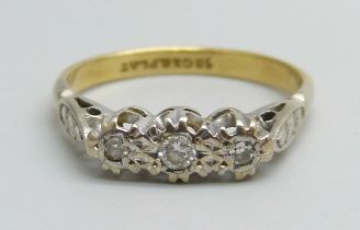 An 18ct gold and platinum three stone diamond ring, 2.8g, M