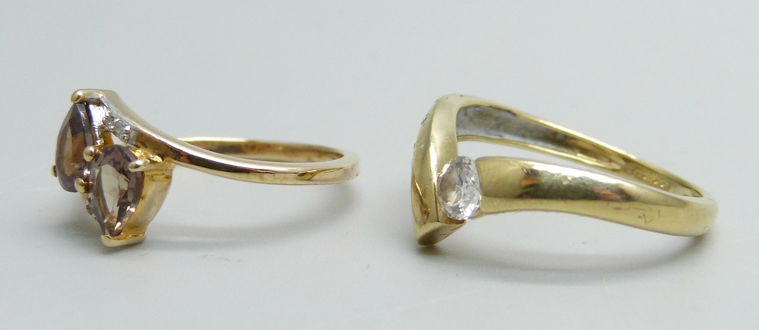 A 14ct gold solitaire ring, 2.1g, M, and a 10k gold crossover ring, 2.1g, L - Image 2 of 3