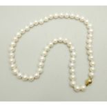 A string of cultured pearls with a 9ct gold clasp, approximately 46cm, 40g