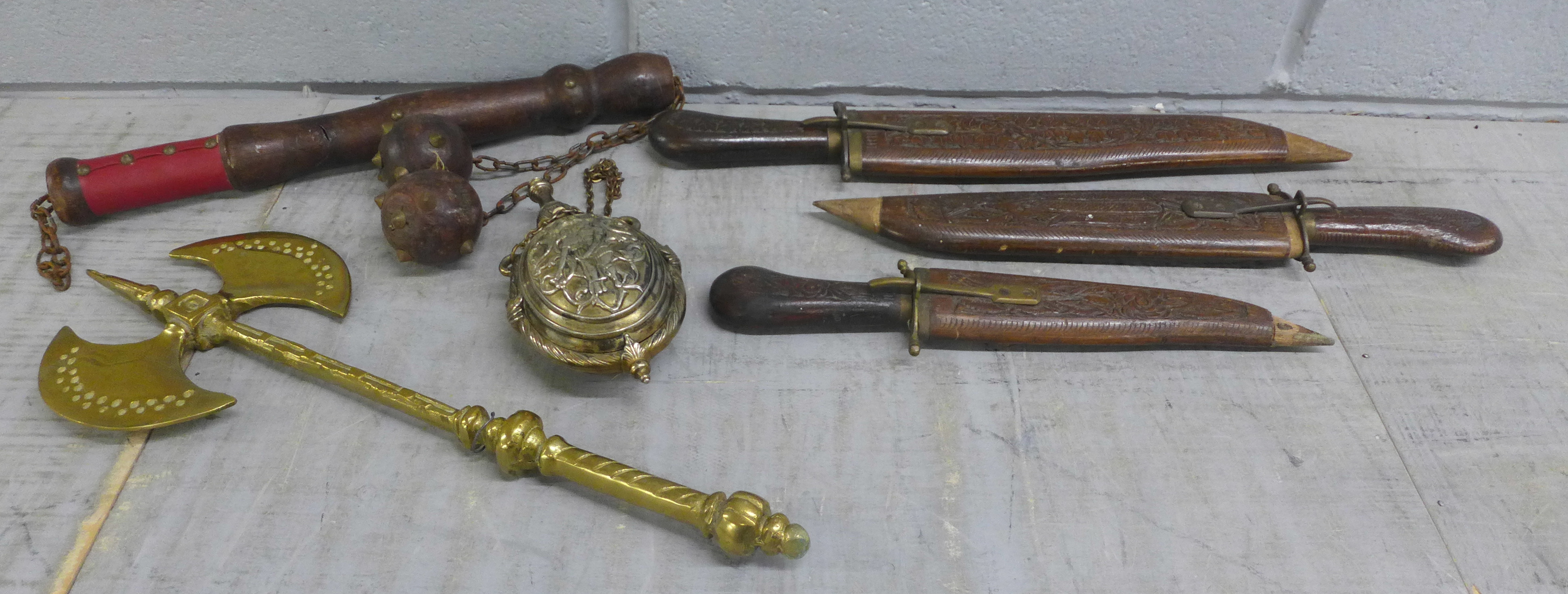 A brass axe, three carving knives, flail and a plated flask **PLEASE NOTE THIS LOT IS NOT ELIGIBLE