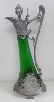 An Art Nouveau green glass and pewter claret jug