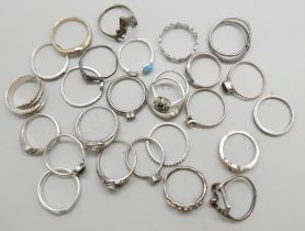Twenty two silver rings, 46g, three unmarked rings, and a 14k white gold ring (a/f, missing two