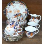 An early 20th Century Royal Crown Derby Imari tea set, six setting, lacking sugar bowl, registration