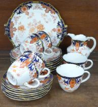 An early 20th Century Royal Crown Derby Imari tea set, six setting, lacking sugar bowl, registration