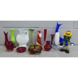 A box of mixed coloured glass including Murano clown, West German vase, Swedish bud vases **PLEASE