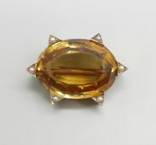 A 9ct gold mounted brooch set with an oval citrine and seed pearls, stone measures approximately 2.