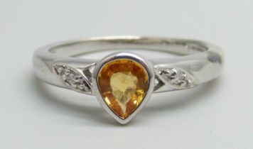 A 9k white gold, diamond and orange stone ring, 2.6g, N/O