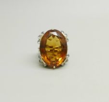 A yellow metal ring set with a citrine and rose cut diamonds, tests as 15ct gold, 15.2g, stone