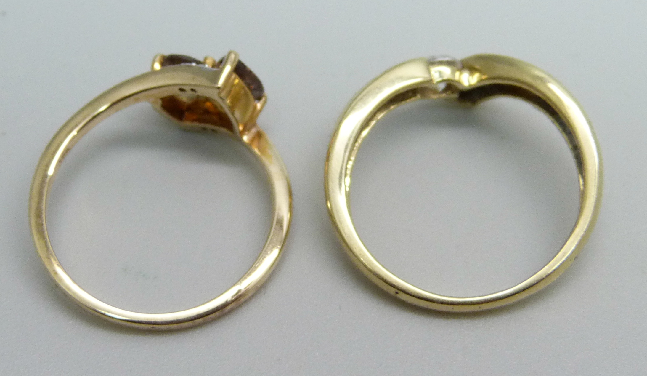 A 14ct gold solitaire ring, 2.1g, M, and a 10k gold crossover ring, 2.1g, L - Image 3 of 3