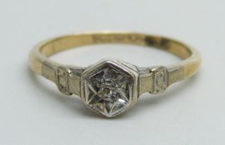 A 9ct gold and platinum ring set with a small diamond, 1.6g, K