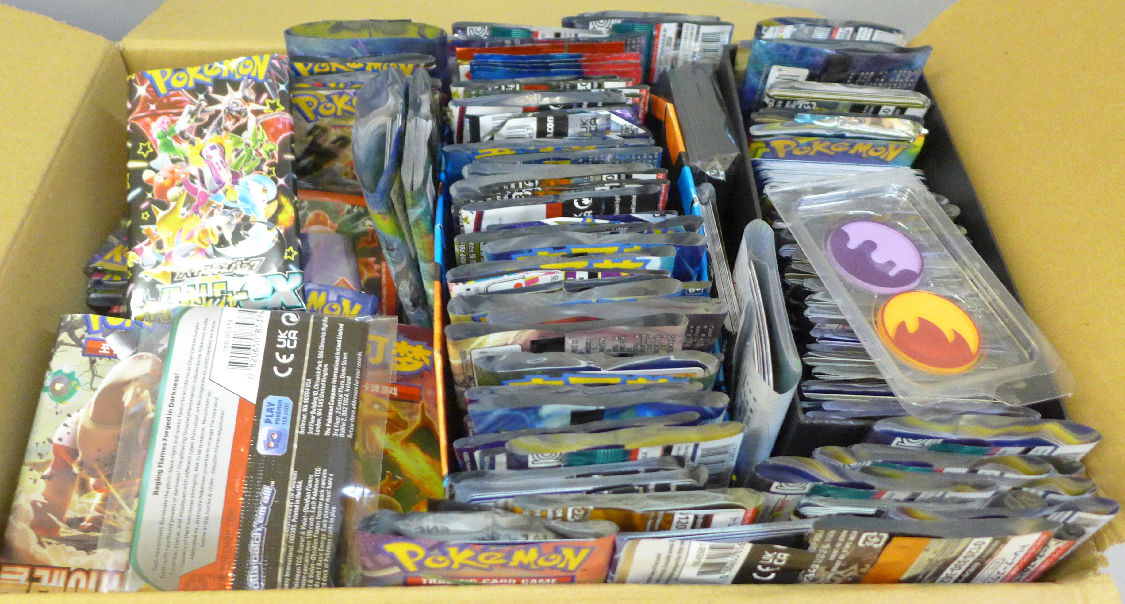 A box of English and Japanese Pokemon Evolutions packs, opened plus Chinese and Korean