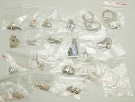 Twenty silver pendants and chains