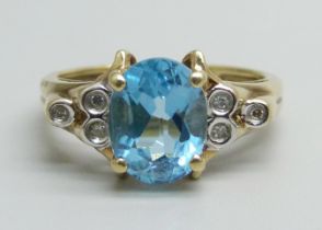 A 9ct gold, diamond and topaz ring, 2.9g, L