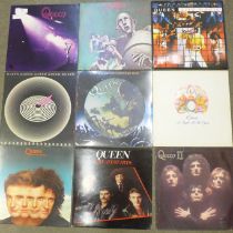 Ten Queen LP records and two 12" singles