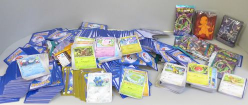Open packs of Pokemon cards, Japanese and English and Pokemon stickers