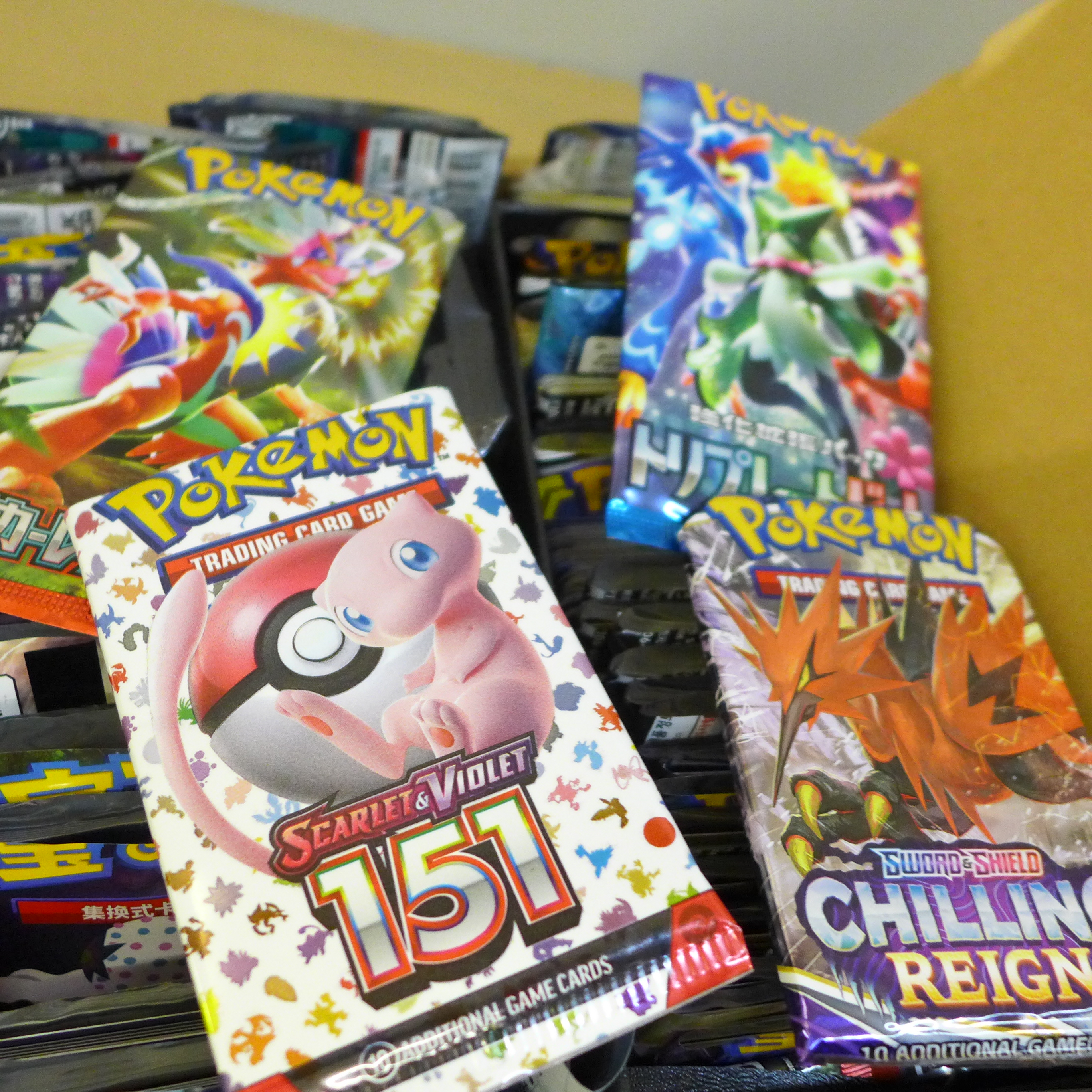 A box of English and Japanese Pokemon Evolutions packs, opened plus Chinese and Korean - Image 6 of 7