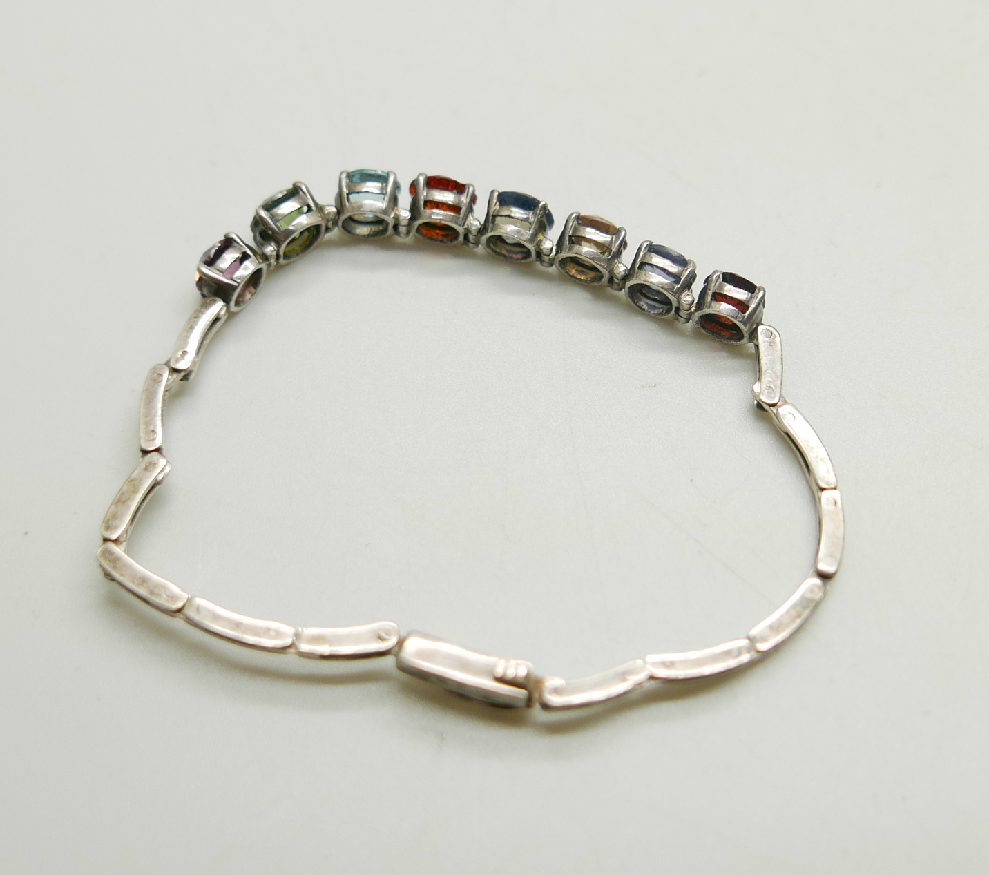 A white metal bracelet set with eight multi-coloured stones, 8g, approximately 16.5cm long - Image 3 of 3