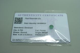 A 0.75ct emerald, with certificate
