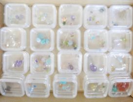 A quantity of loose gemstones including Ethiopian opal, amethyst, garnets, etc.