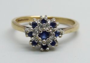 A 9ct gold, sapphire and diamond cluster ring, 1.9g, J/K