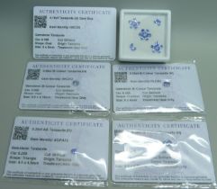 A collection of unmounted tanzanite stones, with certificates