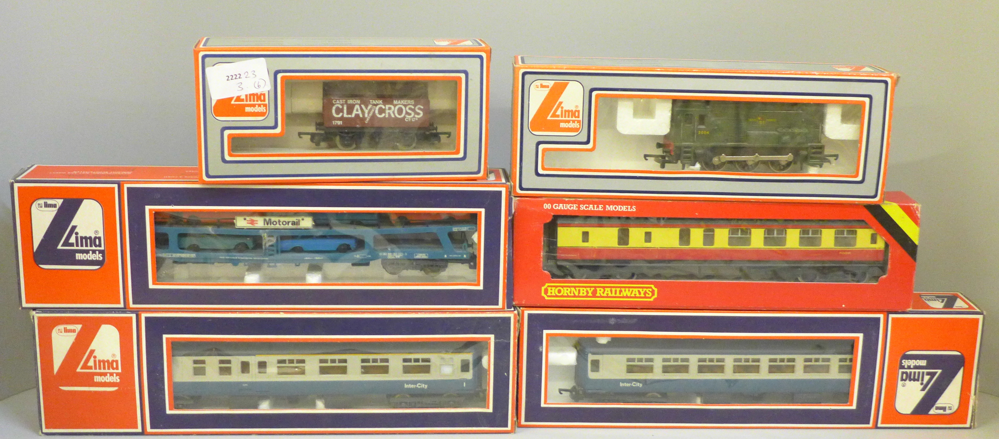 A collection of 00 gauge model rail; Hornby R437 BR Coach composite, Lima models Clay Cross plank