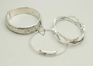 Three silver bangles, 50g