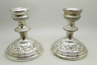 A pair of silver candlesticks, Birmingham 1987, 11.5cm, a/f