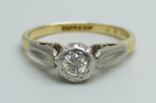 An 18ct gold and platinum set diamond solitaire ring, 2.8g, L